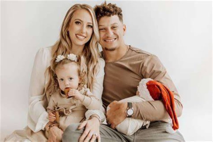 Who is the third child in Nate's family photo?